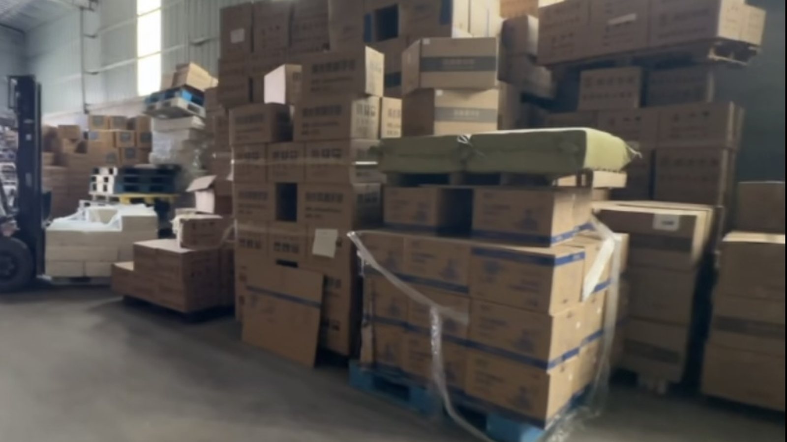 Organized warehouse aisle with goods ready for dispatch
